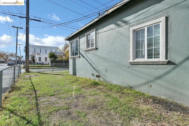 view of home's exterior with a lawn