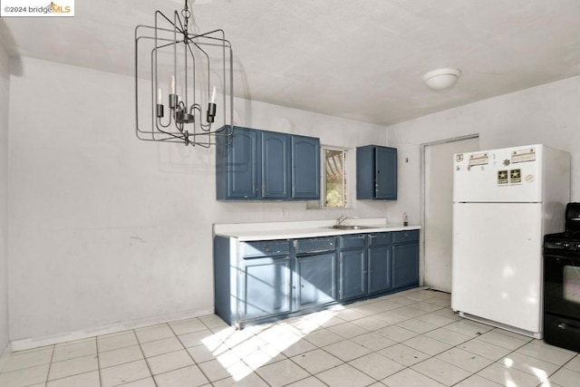 kitchen featuring black range oven, an inviting chandelier, blue cabinets, white refrigerator, and pendant lighting