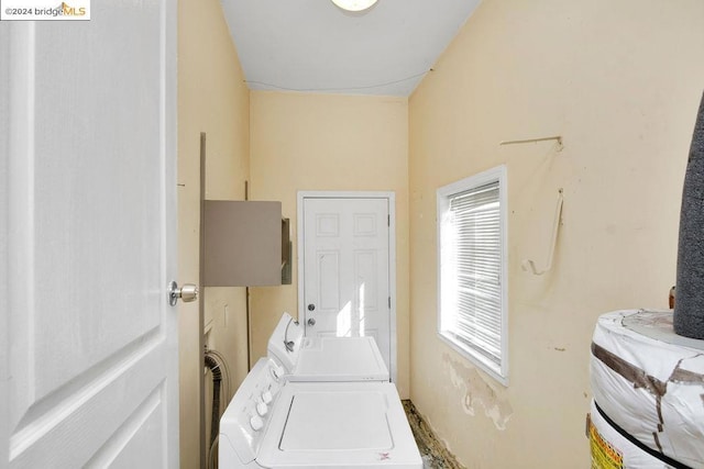 laundry area featuring washing machine and clothes dryer