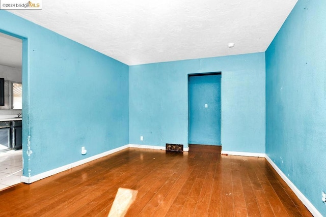 empty room featuring hardwood / wood-style floors