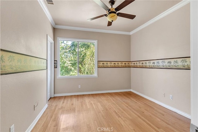 spare room featuring ceiling fan, light hardwood / wood-style floors, and ornamental molding