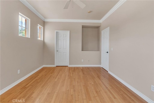 empty room featuring ceiling fan, ornamental molding, and light hardwood / wood-style flooring