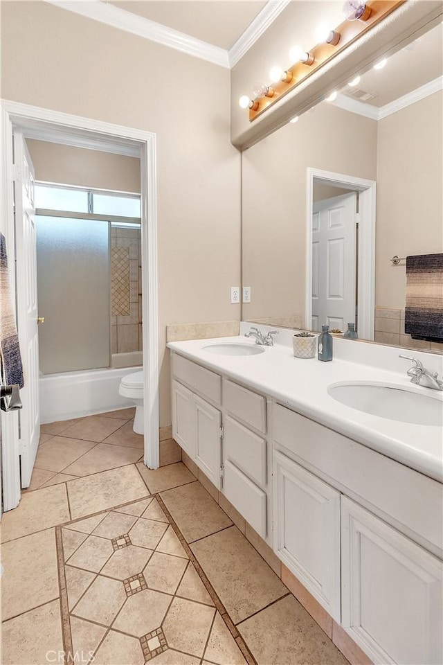 full bathroom with combined bath / shower with glass door, tile patterned floors, toilet, vanity, and ornamental molding