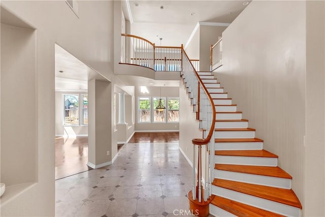 entryway with a towering ceiling and a wealth of natural light