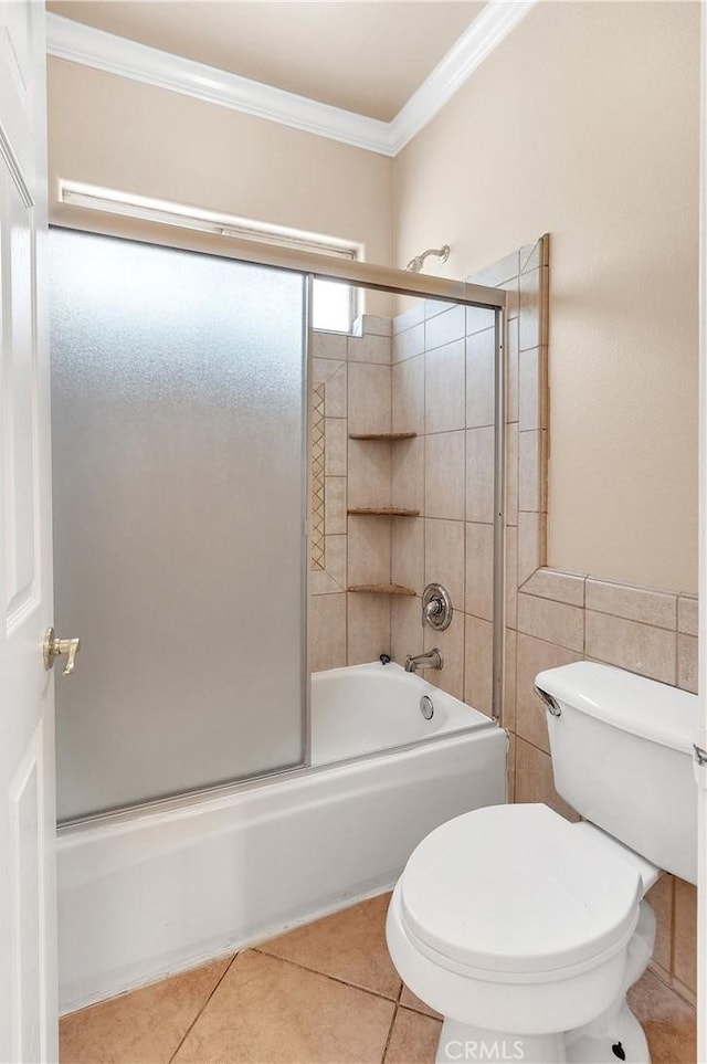 bathroom with tile patterned flooring, toilet, enclosed tub / shower combo, and ornamental molding