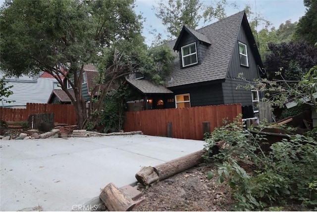 view of property exterior with a patio