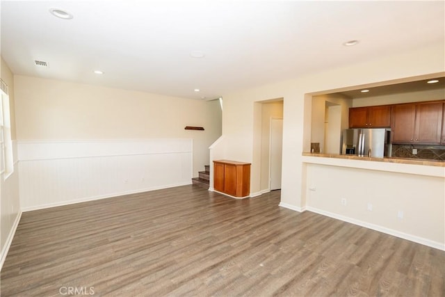 unfurnished living room with hardwood / wood-style floors