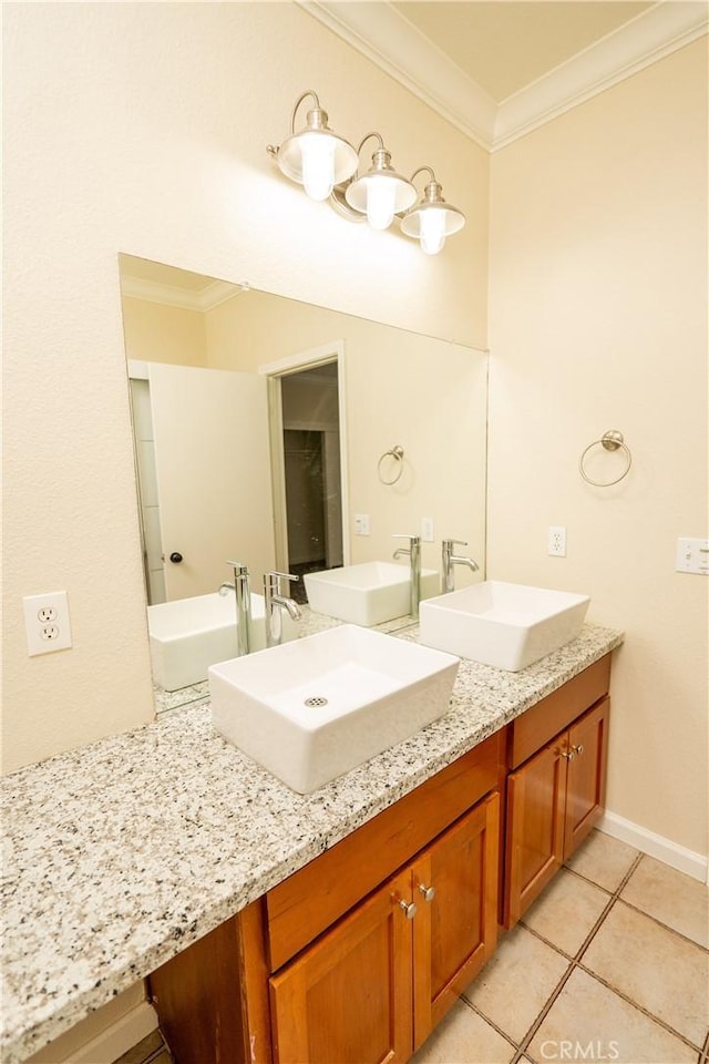 bathroom with tile patterned flooring, vanity, and ornamental molding