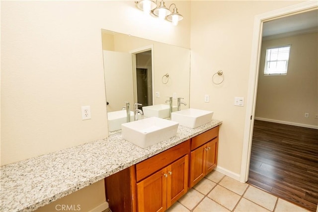 bathroom with vanity and wood-type flooring