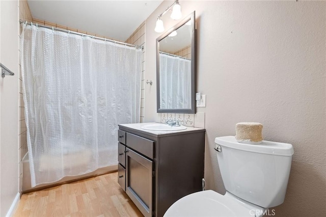 19680 Sugarwood Ct, Hidden Valley Lake, CA 95467 - bathroom with shower / bath combo, wood finished floors, toilet, and vanity
