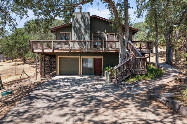 19680 Sugarwood Ct, Hidden Valley Lake, CA 95467 - view of front of house with driveway, a deck, stairway, and a garage