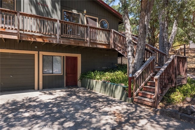 exterior space with a garage and a deck