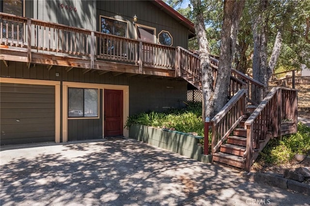 19680 Sugarwood Ct, Hidden Valley Lake, CA 95467 - exterior space with a wooden deck, stairway, a patio area, and a garage