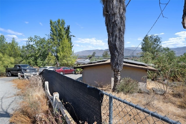 view of home's exterior with a mountain view