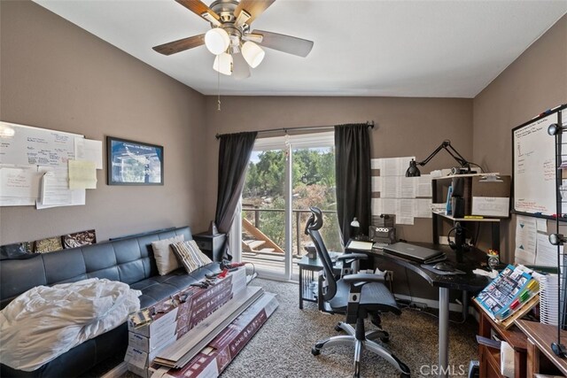 carpeted office space with vaulted ceiling and ceiling fan