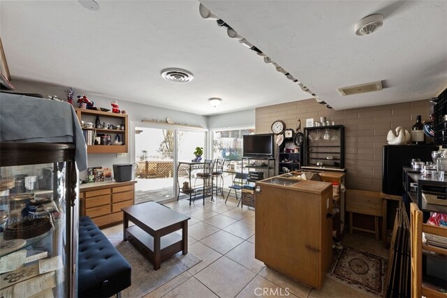 kitchen with light tile patterned flooring