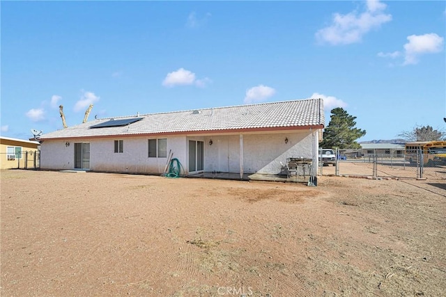 rear view of house with solar panels