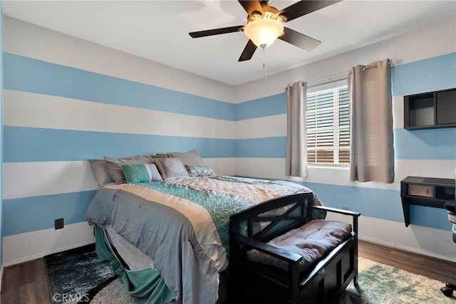 bedroom featuring dark wood-type flooring and ceiling fan