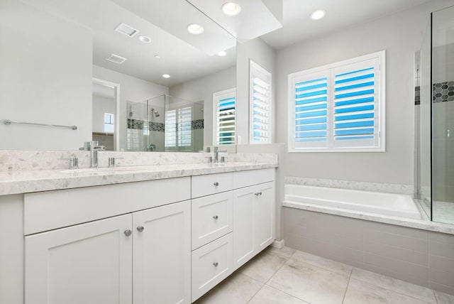 bathroom with vanity, independent shower and bath, and tile patterned floors