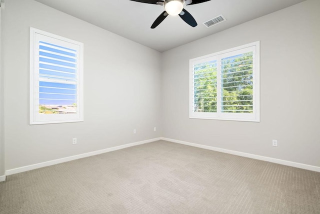 carpeted empty room with ceiling fan