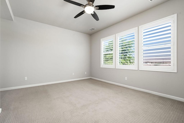 empty room featuring carpet and ceiling fan