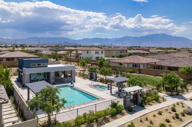 view of pool featuring a patio and a mountain view