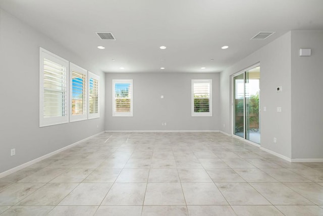 tiled empty room with plenty of natural light