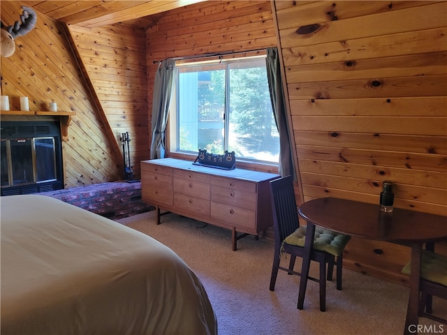 bedroom featuring vaulted ceiling with beams, light colored carpet, wooden walls, and wooden ceiling