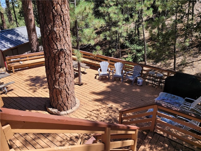 wooden terrace featuring grilling area