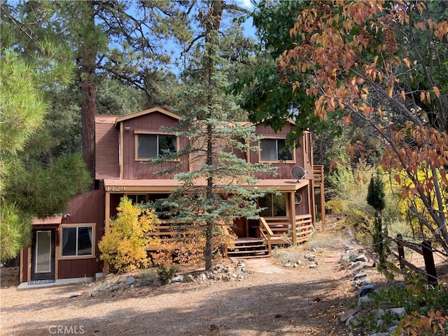 view of front of property with a wooden deck