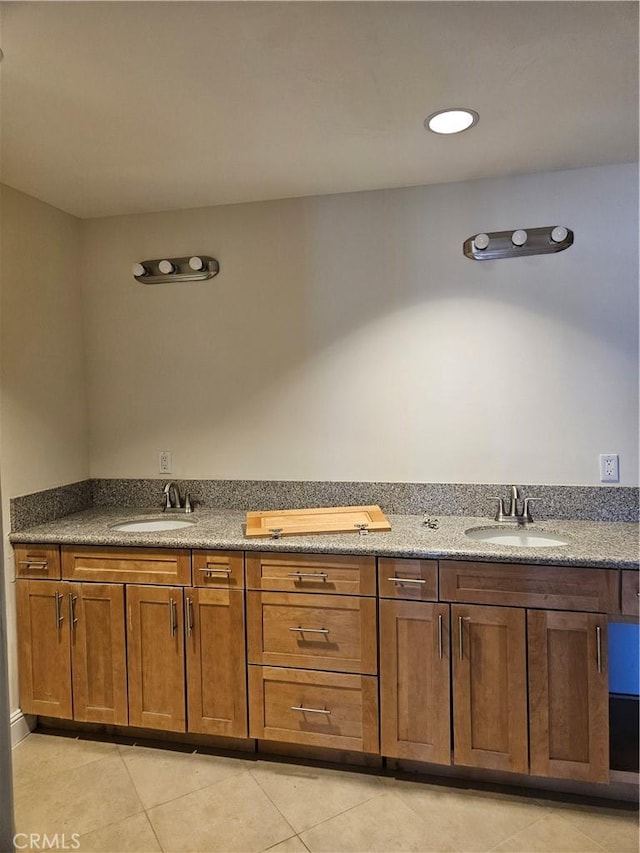 bathroom with tile patterned flooring and vanity