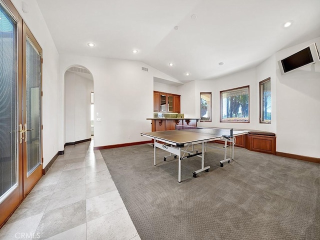 playroom with light colored carpet and vaulted ceiling