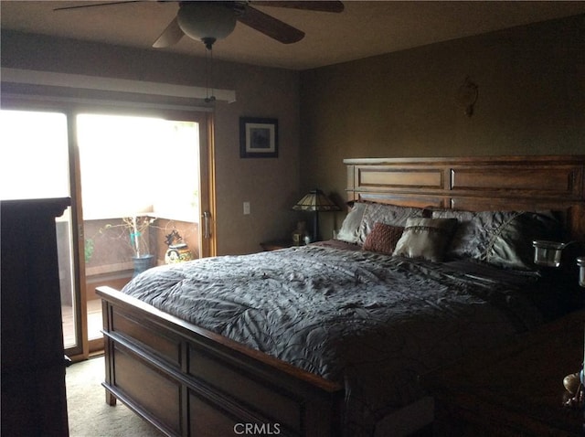 bedroom with light colored carpet and ceiling fan