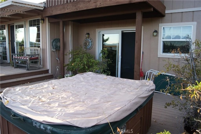 exterior space featuring a hot tub