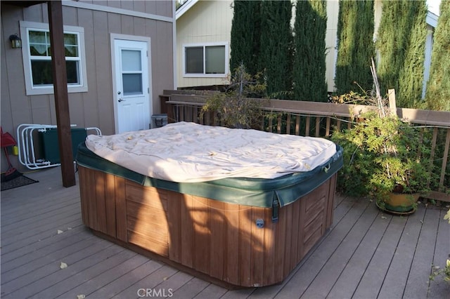 deck with a hot tub