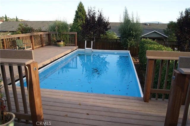 view of pool with a wooden deck