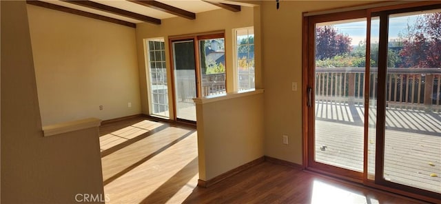 entryway with beamed ceiling and wood-type flooring