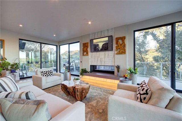 living room featuring a tiled fireplace