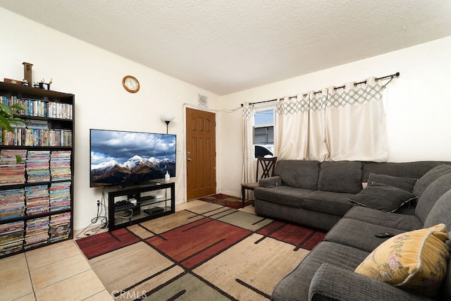 living room featuring tile patterned flooring and a textured ceiling