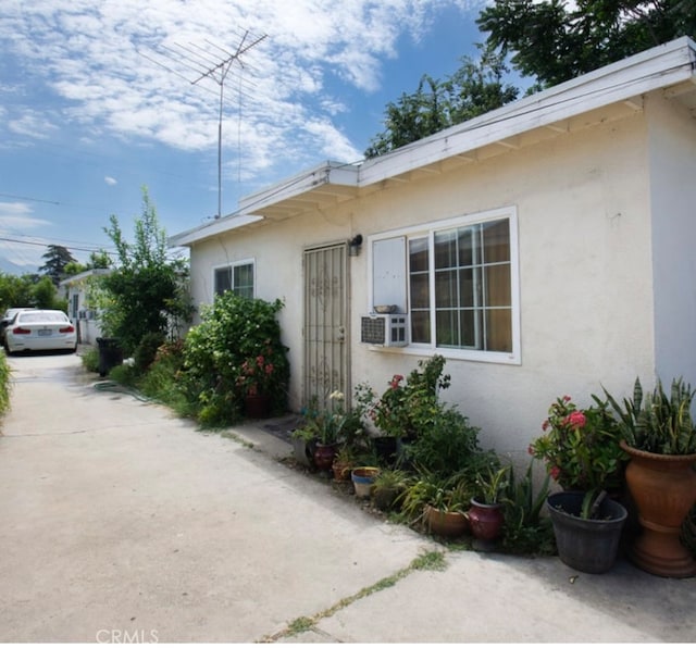 view of side of home with cooling unit