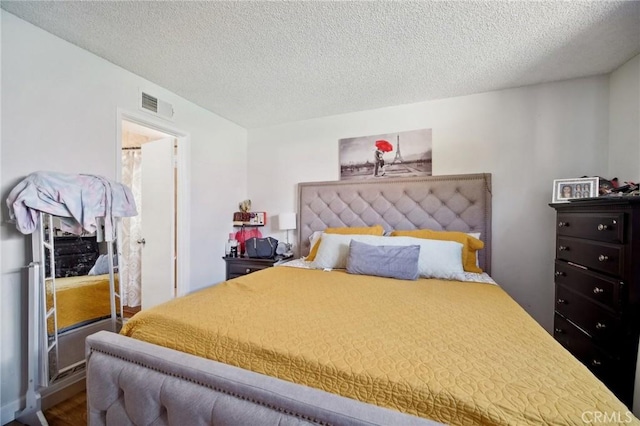 bedroom featuring a textured ceiling