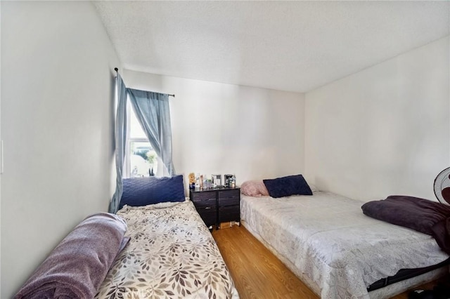 bedroom with light wood-type flooring