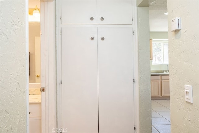 details with sink and tile patterned flooring