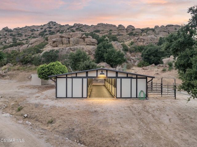 view of outdoor structure at dusk