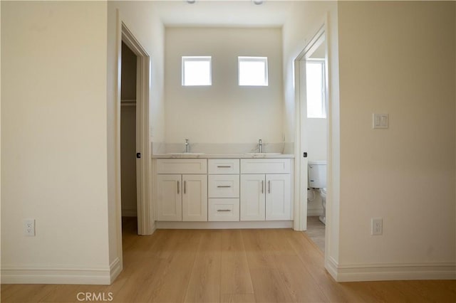 bathroom featuring vanity, hardwood / wood-style floors, plenty of natural light, and toilet