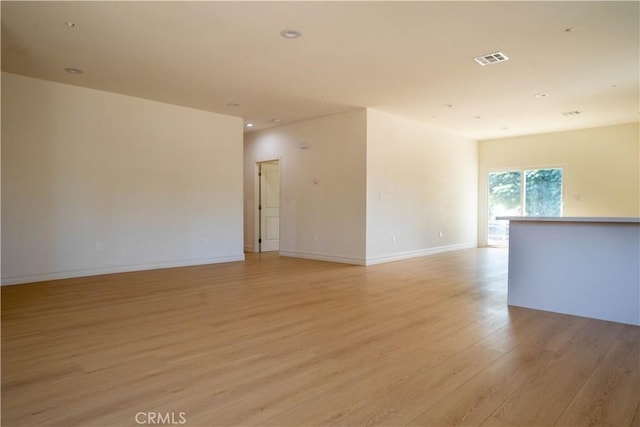 spare room featuring light hardwood / wood-style flooring