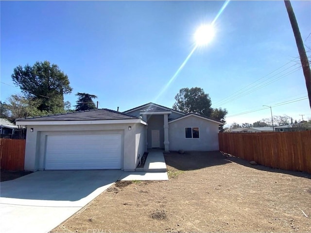 single story home featuring a garage