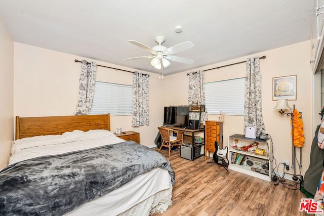 bedroom featuring ceiling fan and hardwood / wood-style flooring