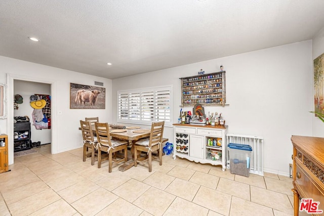 tiled dining area with indoor bar