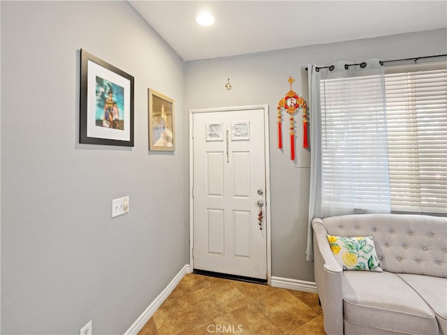 foyer entrance with light tile patterned floors